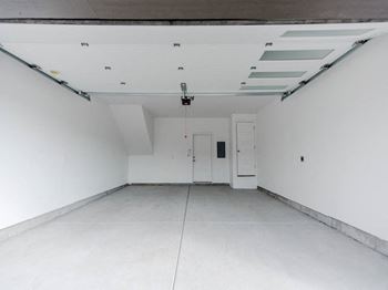 an garage room with a white wall and ceiling at The Austin Townhomes, Draper, UT